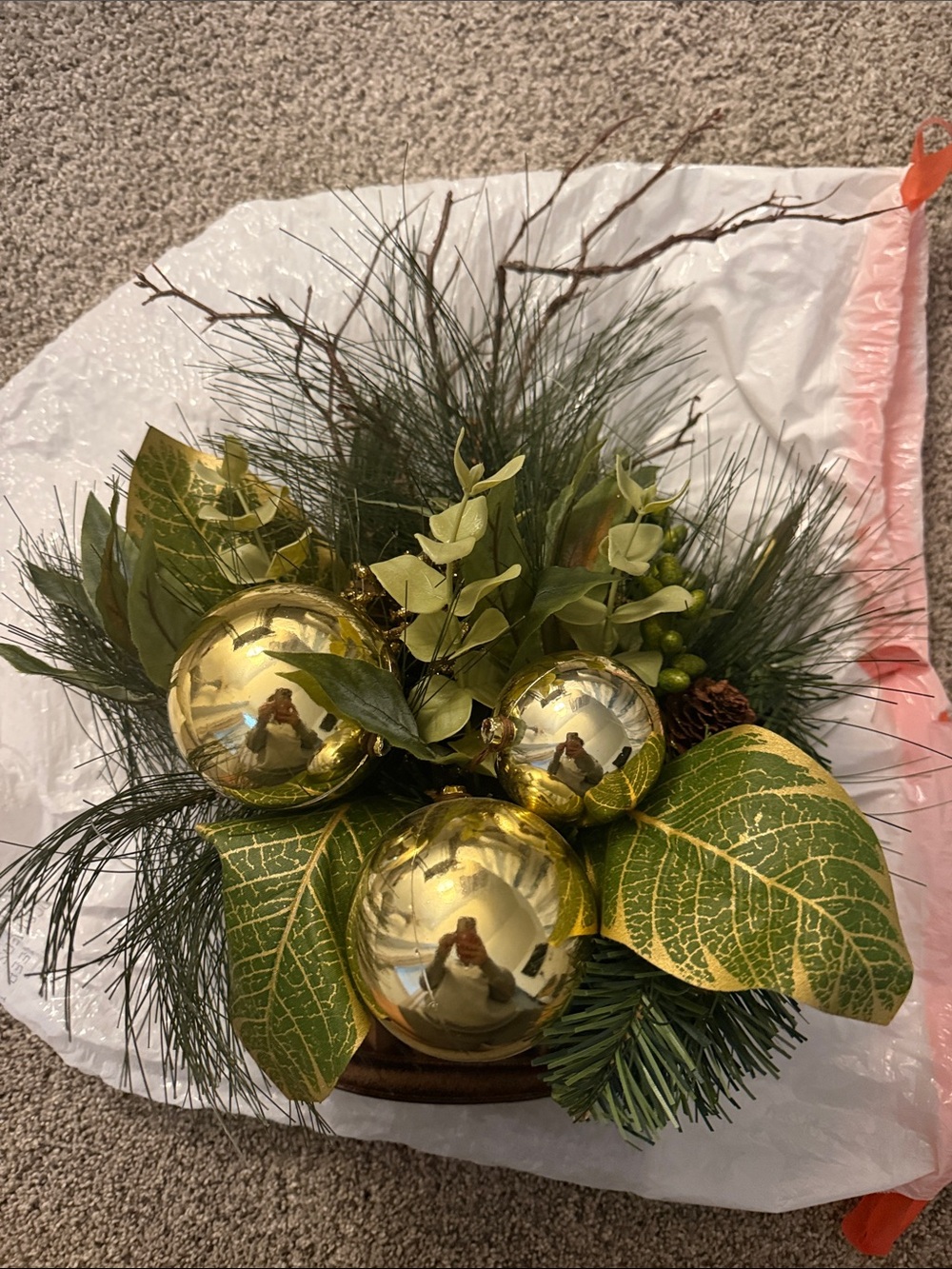 Holiday faux flower arrangement with ornaments